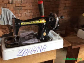 A brand new hand crank sewing machine
