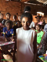 Displaying the first dress made in the workshop