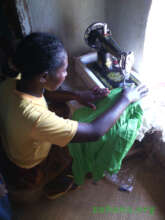 Sharing the two sewing machine amongst the women