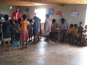 Young and old listening to Santa