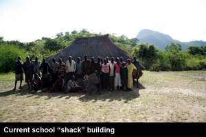 Community members in front of school shack