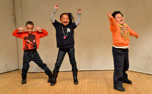 Students in a creative movement and music workshop