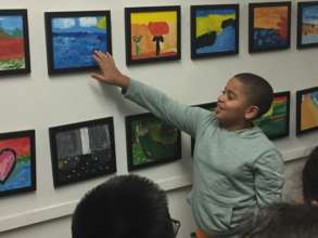 Student sharing his painting at field trip.