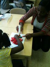 AFA intern Leslie assists in the LTA classroom.