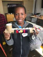 Student with his original flashlight design.