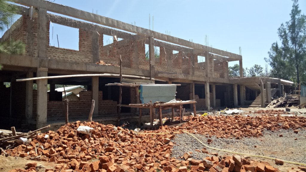 Help complete the construction of classrooms Block