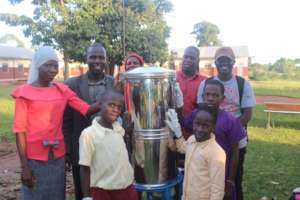 Deputy Director handing over the water filter
