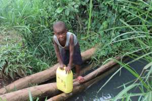 a kid at a dirty well