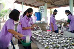 Preparing a meal at a remote charity school.