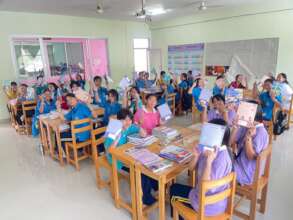 Students receive this years books and supplies