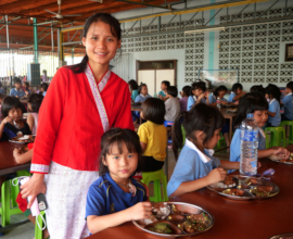 Members of Rajapark Institute serve lunch at DWS