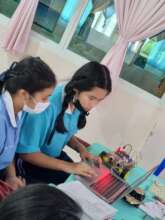 Students make and program simple robots.