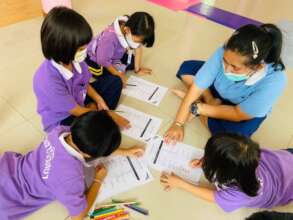 Older girls volunteer tutoring for younger girls.
