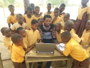 Children enjoying their laptop in school