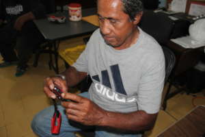 Chief Kelak (Dehpek/Takaiou Community) with camera