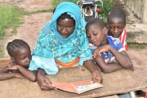 Grandmothers teach children about their traditions