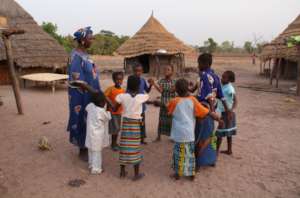 Grandmother teaching traditional dance