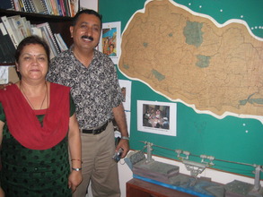 Nandu and his wife in their home/office