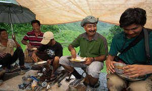 VTS repair crew with tools and lunch under shelter