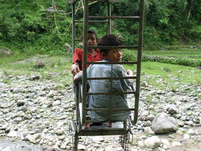 two boys crossing the river