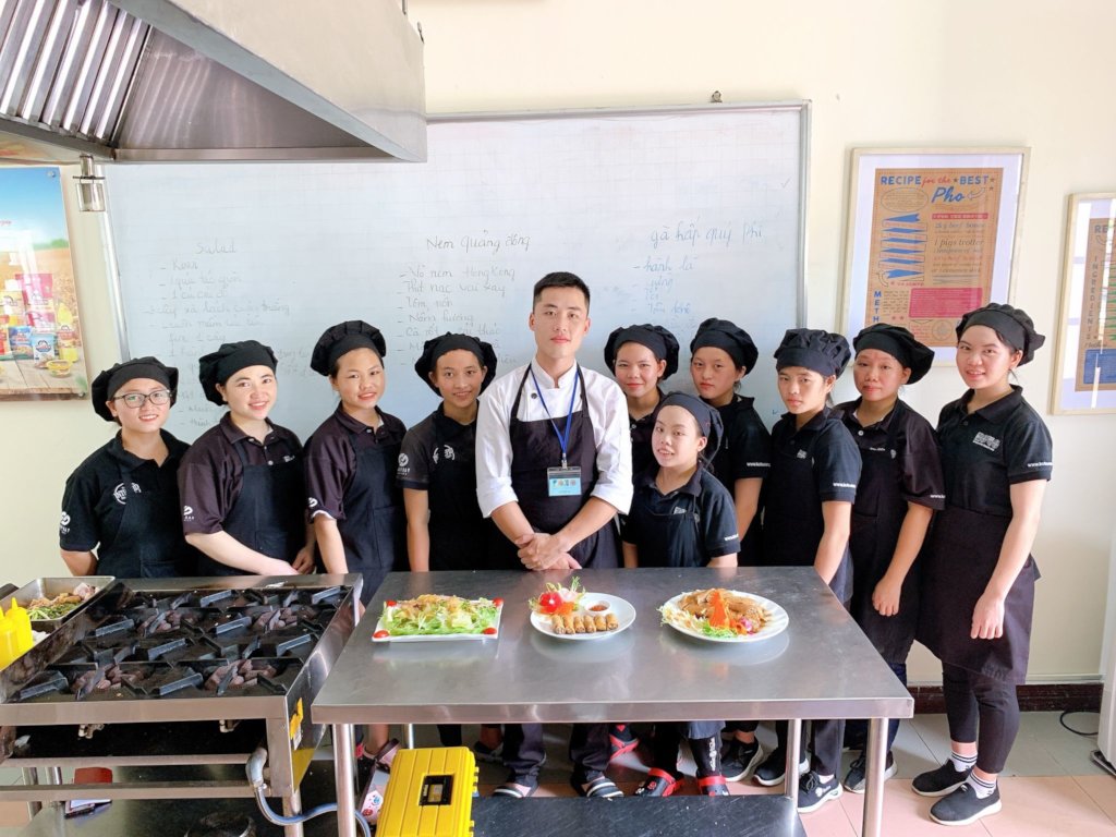 Chef training with a restaurant's kitchen manager