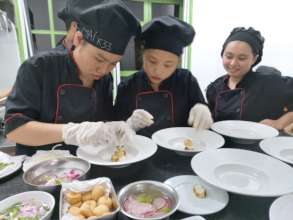 Trainees preparing a dish