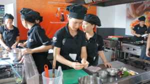 Trainees preparing a dish
