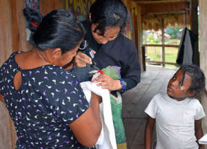 Treating a Scarlet Macaw Before Her Release