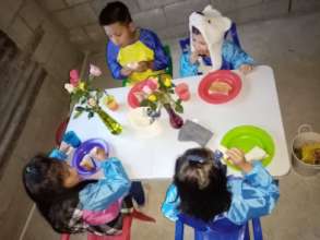 Students prepare and eat their snack
