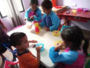 Students eating snack in new kitchen