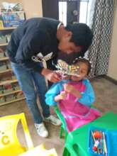Teacher helping student during science lesson