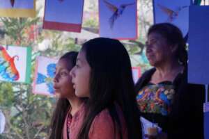 Family in attendance observing exhibit