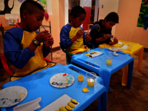 Students painting their own tic-tac-toe game