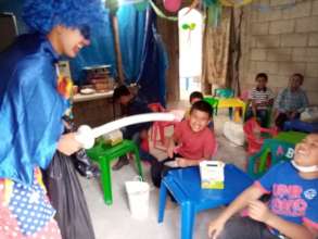 Students laughing at the clowns jokes