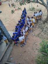 Some of the 100 students in their new uniforms