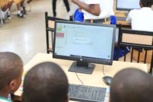 Students working on the Robotics code