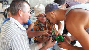 Construction guys repairing a broken tool
