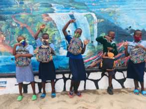 Scholars after collecting bags and school books.