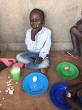 Child eating a meal prepared in the new kitchen