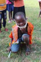 Child smiling in mask