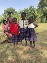 Children trying on new school uniforms