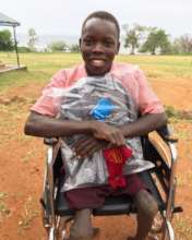 Goza with his new wheelchair and backpack