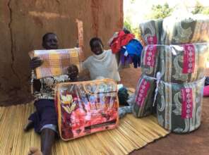 A sponsored child, Peter, with new bedding