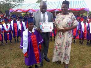 Child with graduation certificate