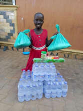 A sponsored child with bottled water