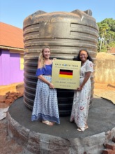 Volunteers with the newest rainwater tank
