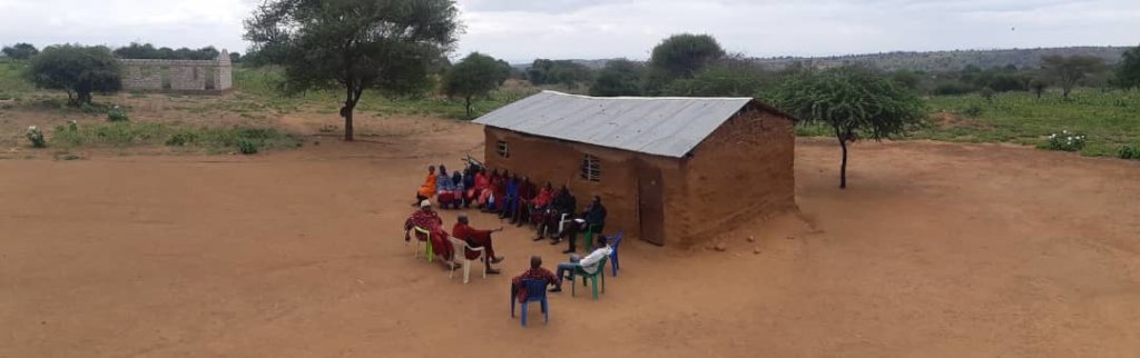 Community discussion in front of the pre-school