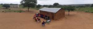 Community discussion in front of the pre-school