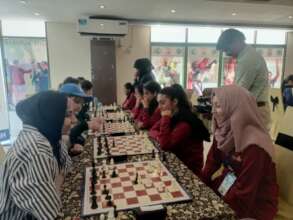 Students engaged in a captivating chess match