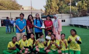 A happy moment captured with Futsal Team's trophy